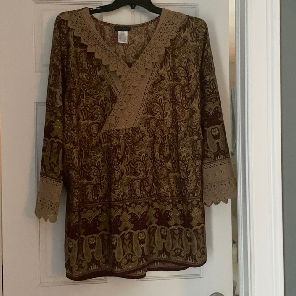 A beautiful silky top.. can be dressy or worn with jeans!